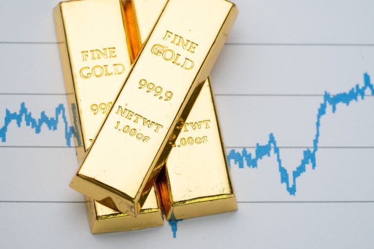 Gold ticks lower as dollar firms